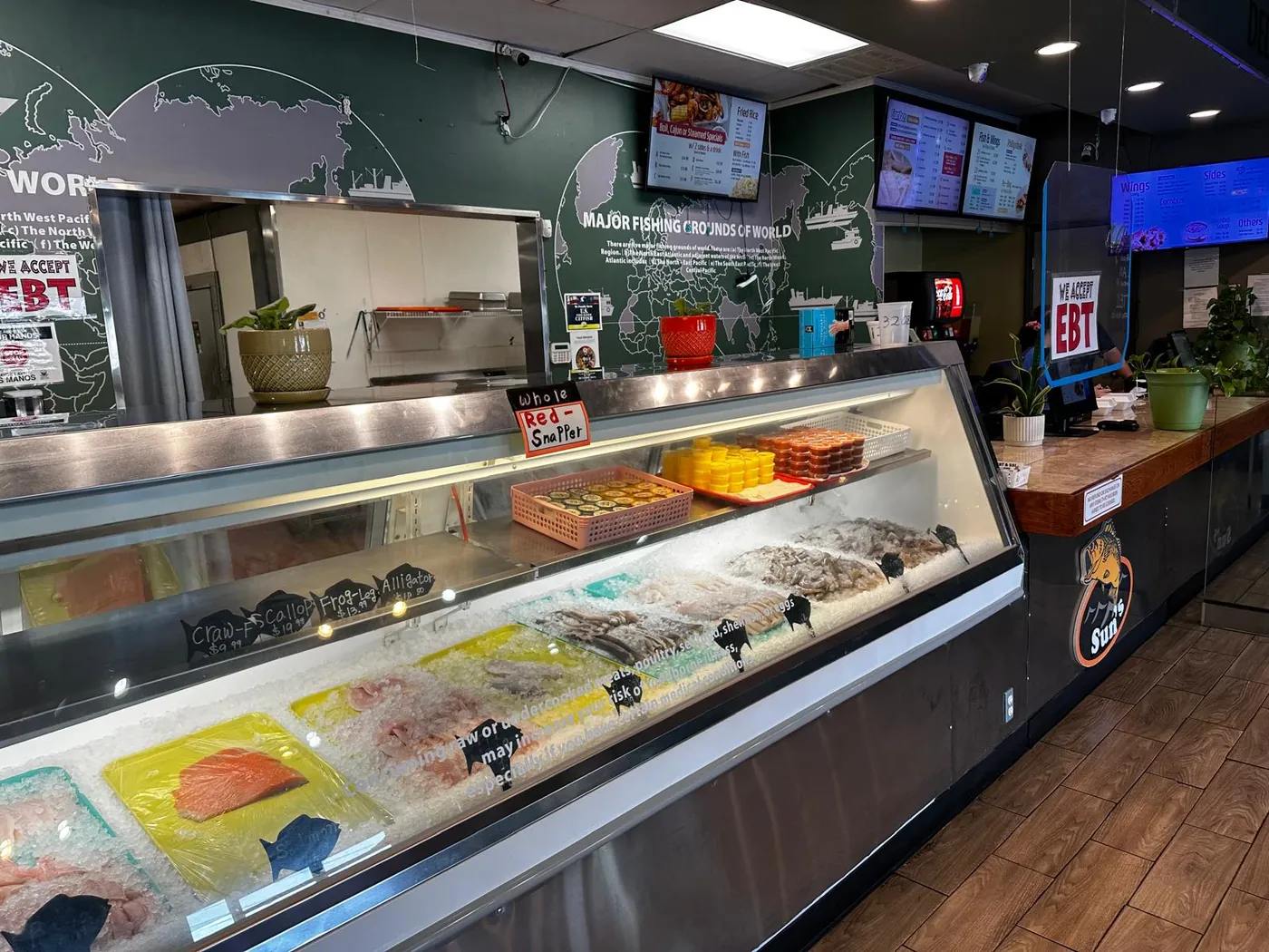 The fresh fish case at Koo's, stocked with fillets, shrimp and shellfish on ice