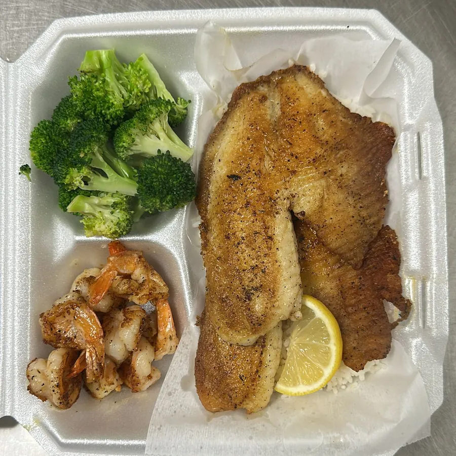 Grilled tilapia over rice with peppered shrimp and broccoli