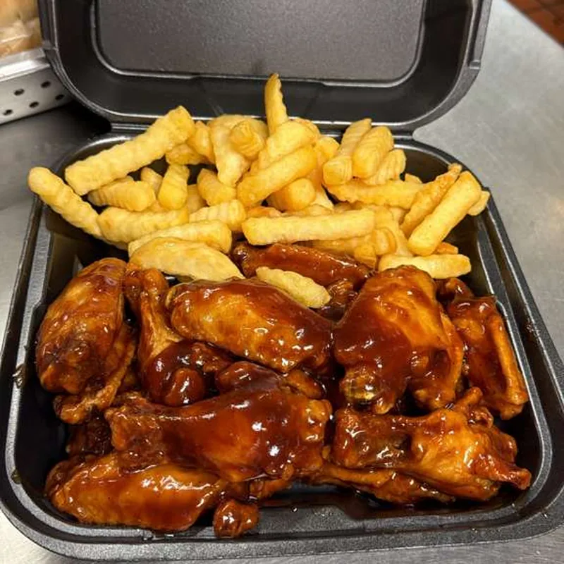Barbecue sauced wings with crinkle fries
